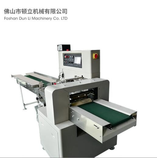 麻辣燙套袋包裝設備非油炸面餅自動進袋機450X速度快包裝廠家訂制